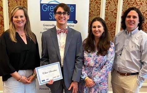 Elliot Sanders receives a scholarship from the Greenville chapter of the Society for Human Resource Management.