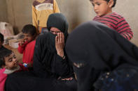 Syrian women and children react after arriving in the northern area of Deir al-Zor, Syria September 24,2017. REUTERS/ Rodi Said