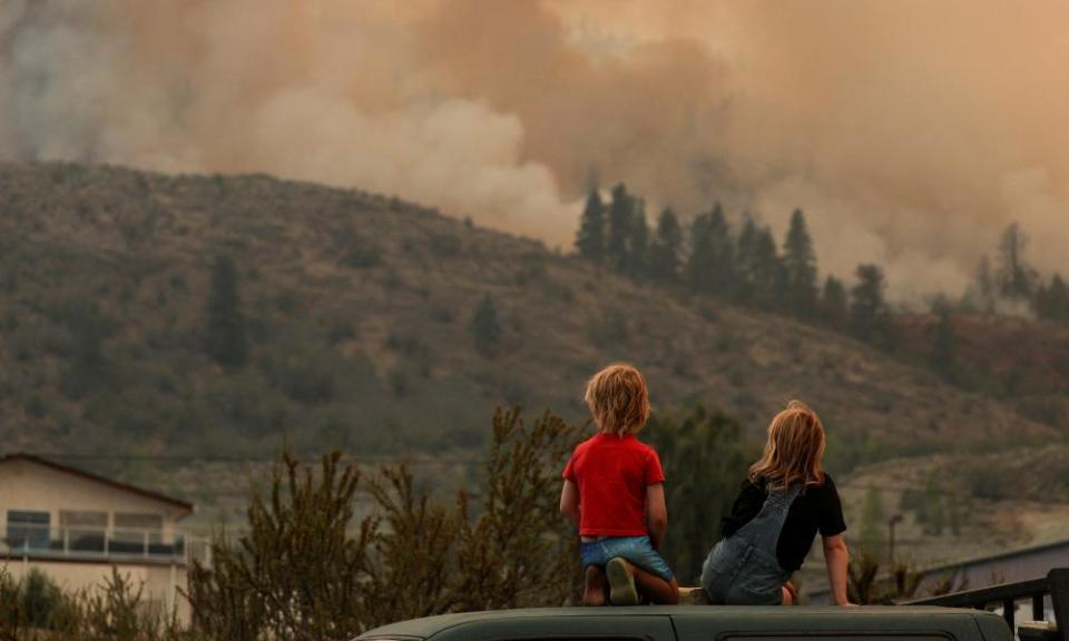The Eagle Bluff wildfire burns across the Canada-US border from the state of Washington into Osoyoos, British Columbia, Canada, on 30 July.