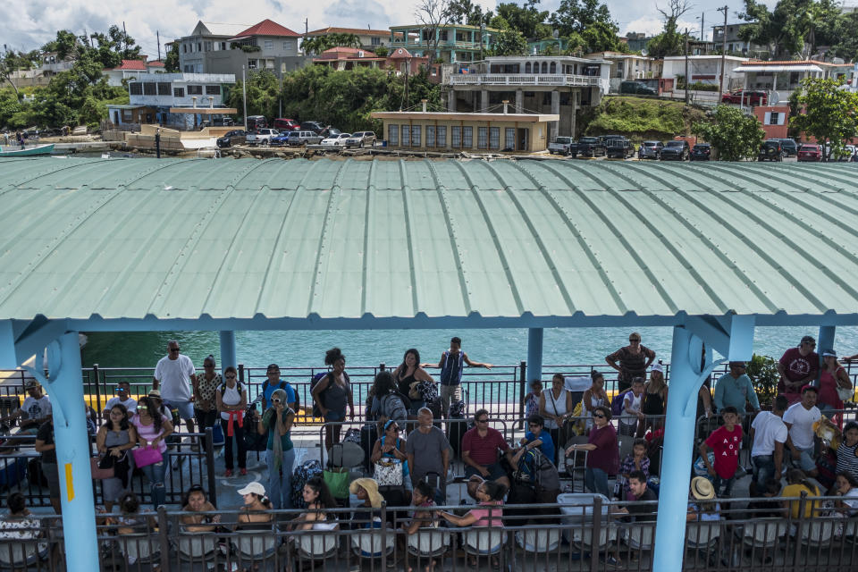 Tourists and Vieques residents wait for the ferry that connects the small, isolated island with the rest of Puerto Rico. (Photo: Dennis M. Rivera Pichardo for HuffPost)