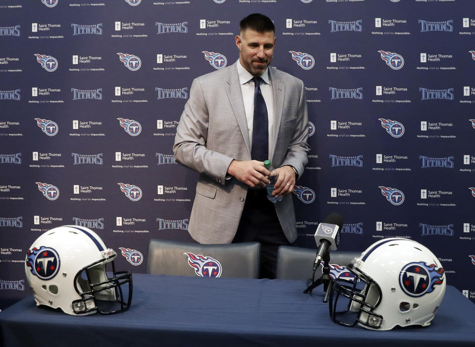 New Tennessee Titans head football coach Mike Vrabel leaves his introductory news conference. (AP)