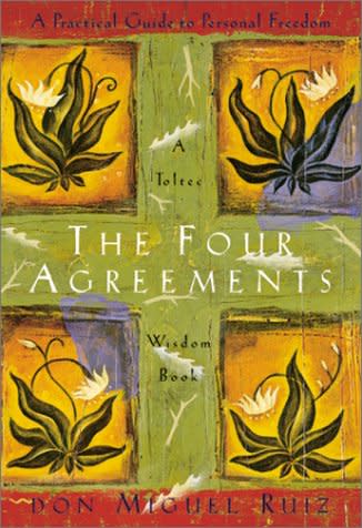 the self-help book called the four agreements on a white background