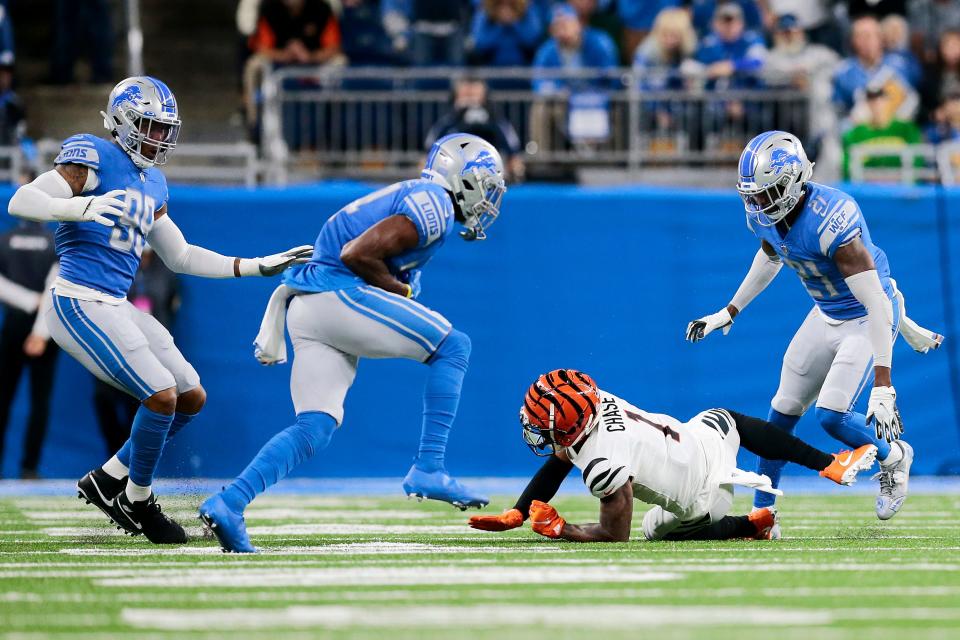 Detroit Lions cornerback Amani Oruwariye (24) intercepts a pass intended for Cincinnati Bengals wide receiver Ja'Marr Chase (1) in the first quarter of the NFL Week 6 game between the Detroit Lions and the Cincinnati Bengals at Ford Field in Detroit on Sunday, Oct. 17, 2021. The Bengals led 10-0 at halftime. 