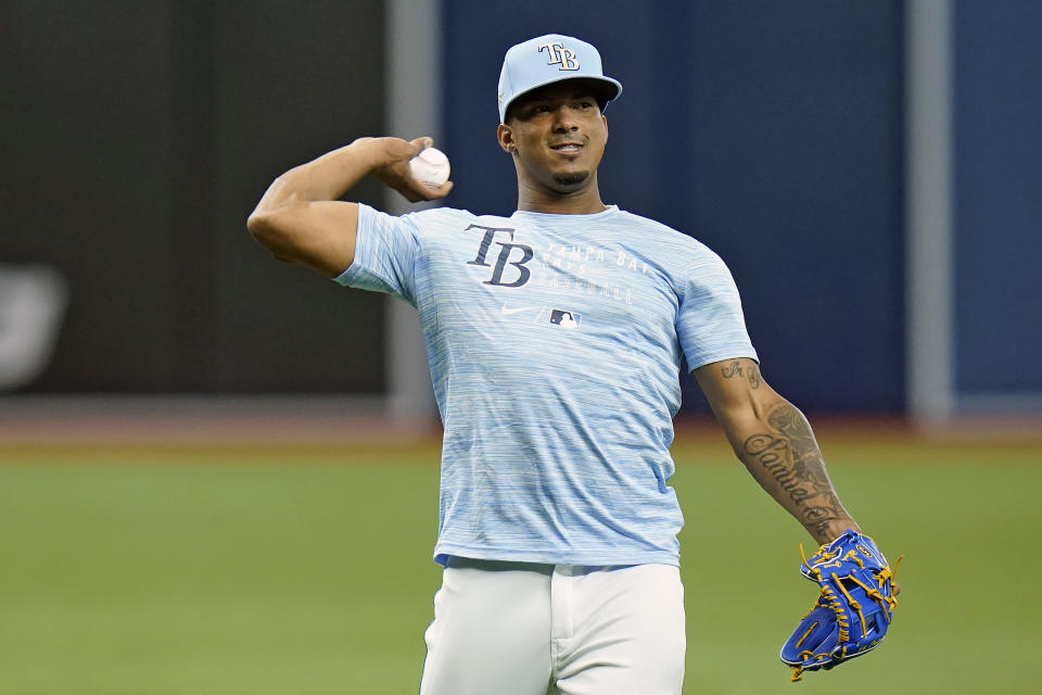 Tampa Bay Rays third baseman Wander Franco throws the ball before a baseball game against the Boston Red Sox Tuesday, June 22, 2021, in St. Petersburg, Fla. The Rays called up Franco from their Class AAA Durham team. (AP Photo/Chris O'Meara)