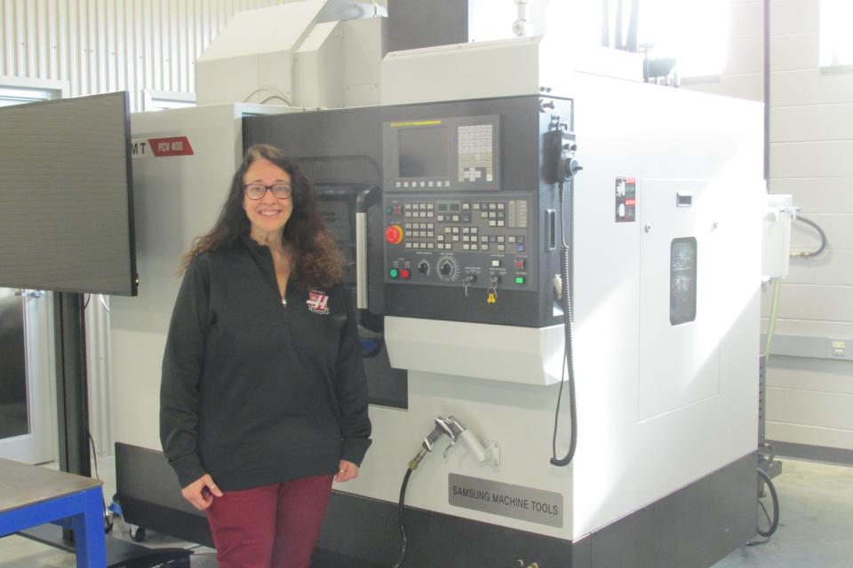 Supervisor of Career and Technical Education Lynette Boggs displays one of the high-tech tools the RAMTEC students use at WCSCC.