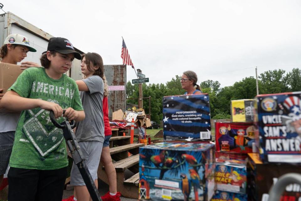 Stacks of fireworks were hauled back to place under a new tent as Dishonest Don’s fireworks prepared to open for business on Wednesday after their tent collapsed on Tuesday night.