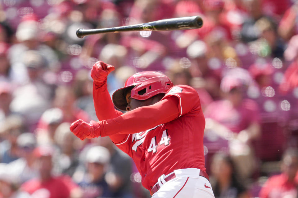 Cincinnati Reds' Aristides Aquino (44) has his bat slip out of his hands during the second inning of a baseball game against the Milwaukee Brewers, Sunday, Sept. 25, 2022, in Cincinnati. (AP Photo/Jeff Dean)