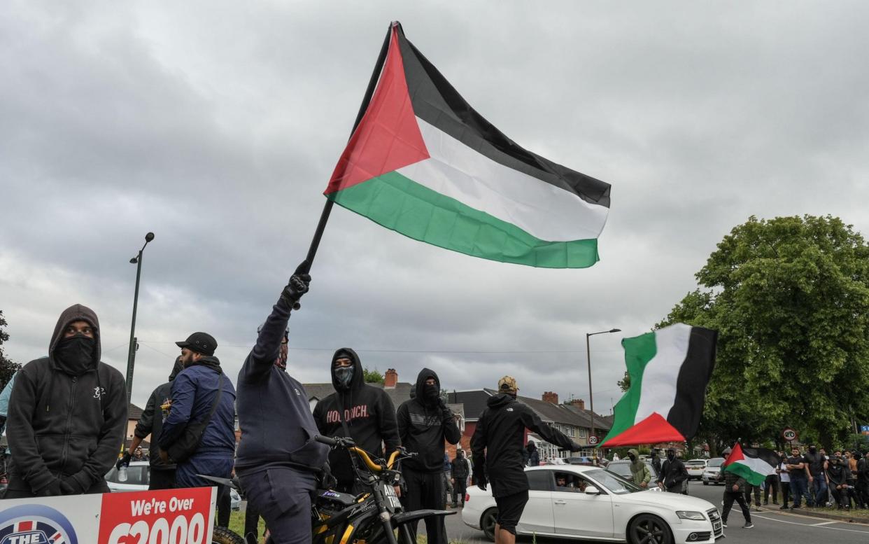 A group with a Palestinian flag in Bordesely Green, Birmingham