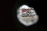 A damaged car is pictured in the breakaway region of Nagorno-Karabakh