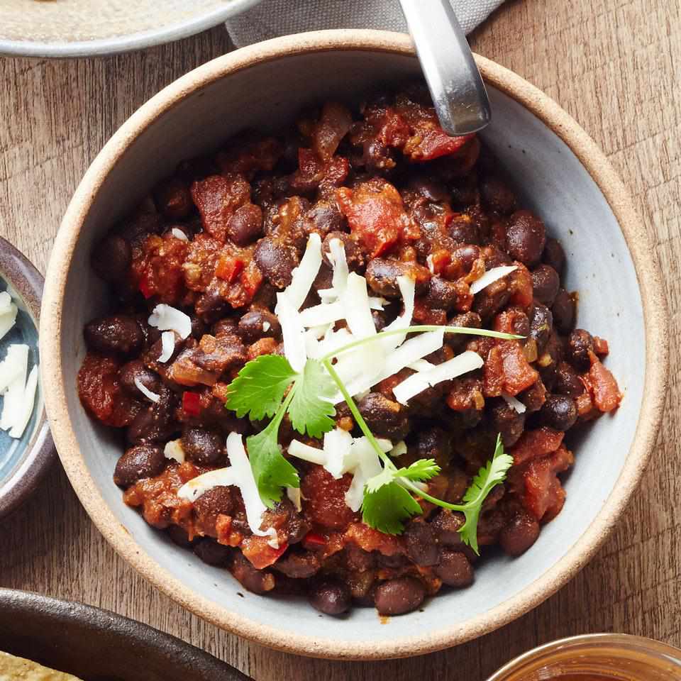 <p>Canned beans and tomatoes make this quick vegetarian chili recipe ready to go in just 30 minutes. Serve over rice or couscous, or with tortilla chips for added crunch, and add extra toppings as you see fit--sliced scallions, chopped fresh cilantro, diced avocado and sliced jalapeños are all tasty choices.</p> <p> <a href="https://www.eatingwell.com/recipe/256489/easy-vegetarian-chili/" rel="nofollow noopener" target="_blank" data-ylk="slk:View Recipe;elm:context_link;itc:0;sec:content-canvas" class="link ">View Recipe</a></p>