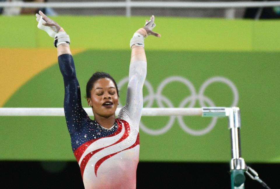 Aug 9, 2016; Rio de Janeiro, Brazil; Gabby Douglas (USA) competes during the women's team finals in the Rio 2016 Summer Olympic Games at Rio Olympic Arena. Mandatory Credit: Robert Hanashiro-USA TODAY Sports