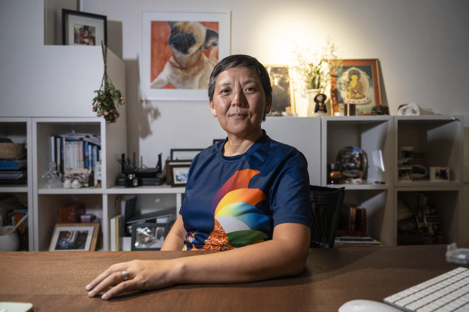 Lisa Lam, co-chair of Gay Games, poses for photographs during an interview in Hong Kong, Tuesday, Oct. 31, 2023. Set to launch on Friday, Nov. 3, 2023, the first Gay Games in Asia are fostering hopes for wider LGBTQ+ inclusion in the Asian financial hub. (AP Photo/Chan Long Hei)