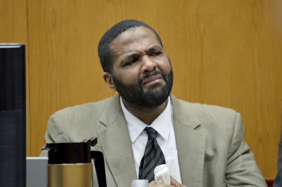 Defendant Willie Cory Godbolt, left, cries as he listens to testimony from Shayla Edwards Wednesday, Feb. 19, 2020, on Day 5 of the capital murder trial of Godbolt at the Pike County Courthouse in Magnolia, Miss. A witness testified Tuesday that Godbolt, on trial in the 2017 shooting deaths of eight people, showed up at her house the night of the killings and that he was carrying two rifles and told her that he had killed a sheriff's deputy. (Donna Campbell/The Daily Leader via AP, Pool)