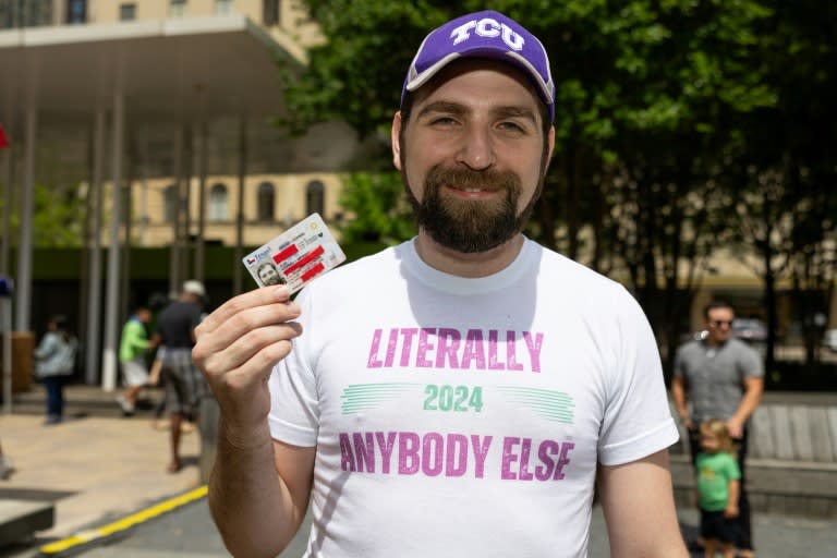 'Literally Anybody Else' poses with his driver's license, hoping for luck on his 2024 White House bid (Aric Becker)