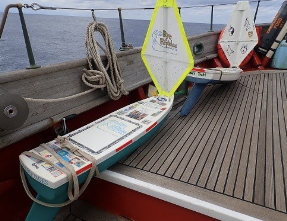 The middle schoolers launched their mini boat on a bigger boat in October 2020, filling it with notes and and other mementos – like a mask they had all signed. / Credit: Sea Education Association