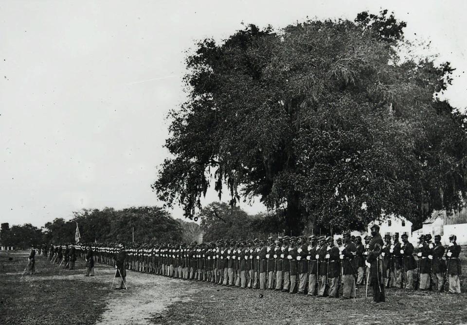 A Black Civil War unit assembled to hear a reading of President Abraham Lincoln's Emancipation Proclamation in 1863.