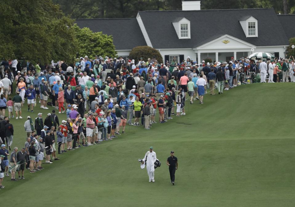 Si-Woo Kim, of South Korea, walks up the first fairway during a practice round for the Masters golf tournament Wednesday, April 4, 2018, in Augusta, Ga. (AP Photo/Matt Slocum)