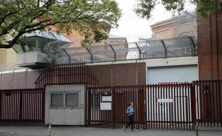 A pedestrian walks past an entrance of Moabit prison where Al Jazeera journalist Ahmed Mansour is being detained in Berlin, Germany, June 22, 2015. REUTERS/Fabrizio Bensch