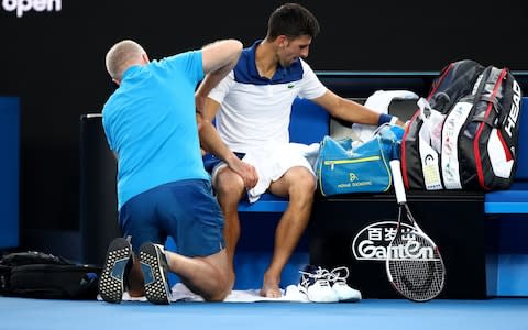 Novak Djokovic of Serbia receives medical treatment in his fourth round match against Hyeon Chung of South Korea on day eight of the 2018 Australian Open at Melbourne Park on January 22, 2018 in Melbourne, Australia - Credit: Getty Images