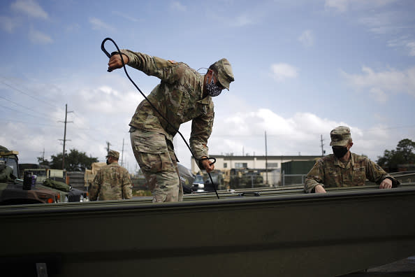 Louisiana Army National Guard soldiers prepare equipment ahead of Hurricane Laura in Lake Charles, Louisiana.