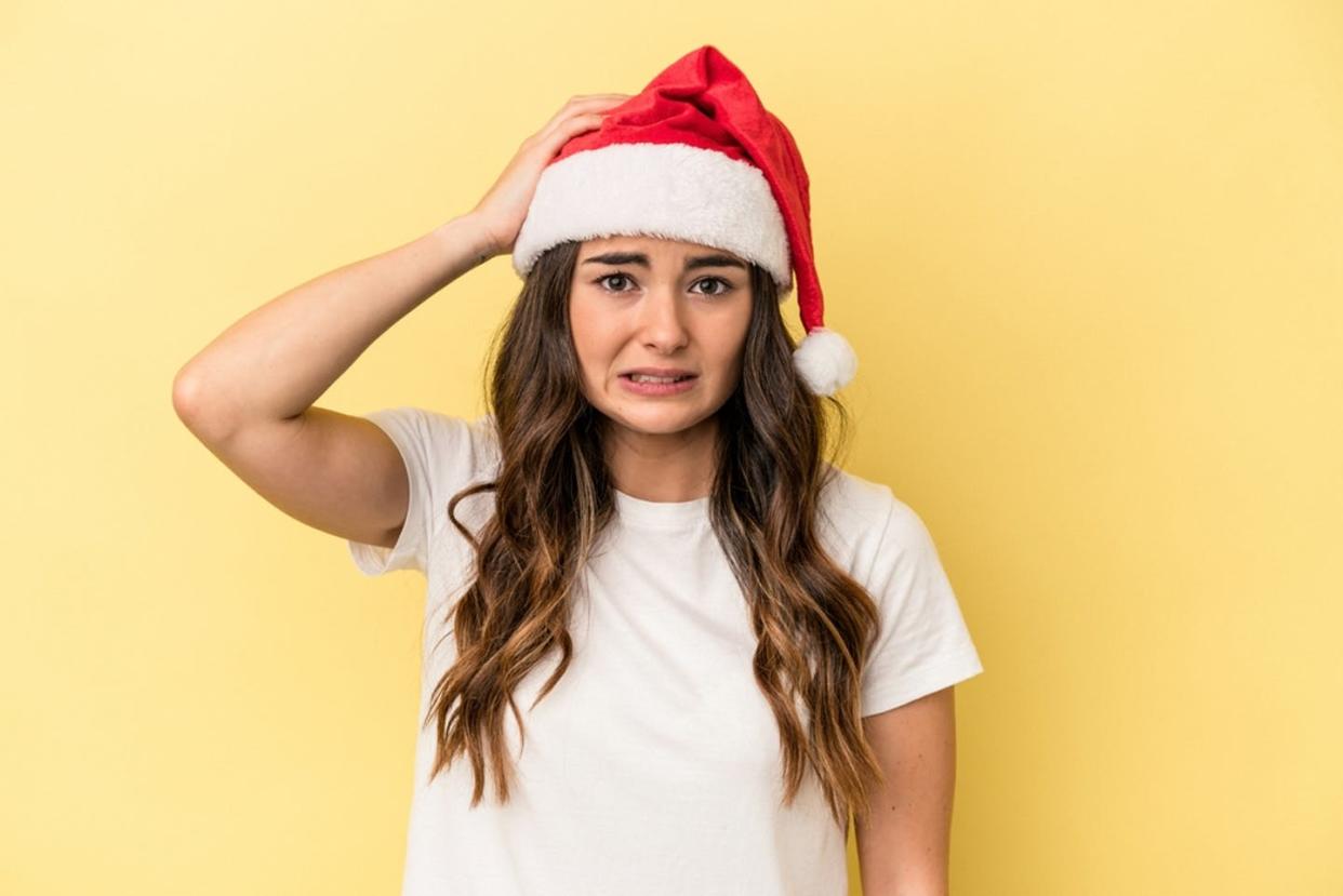  <span class="attribution"><a class="link " href="https://www.shutterstock.com/image-photo/young-caucasian-woman-celebrating-christmas-isolated-2052118517" rel="nofollow noopener" target="_blank" data-ylk="slk:Shutterstock;elm:context_link;itc:0;sec:content-canvas">Shutterstock</a></span>