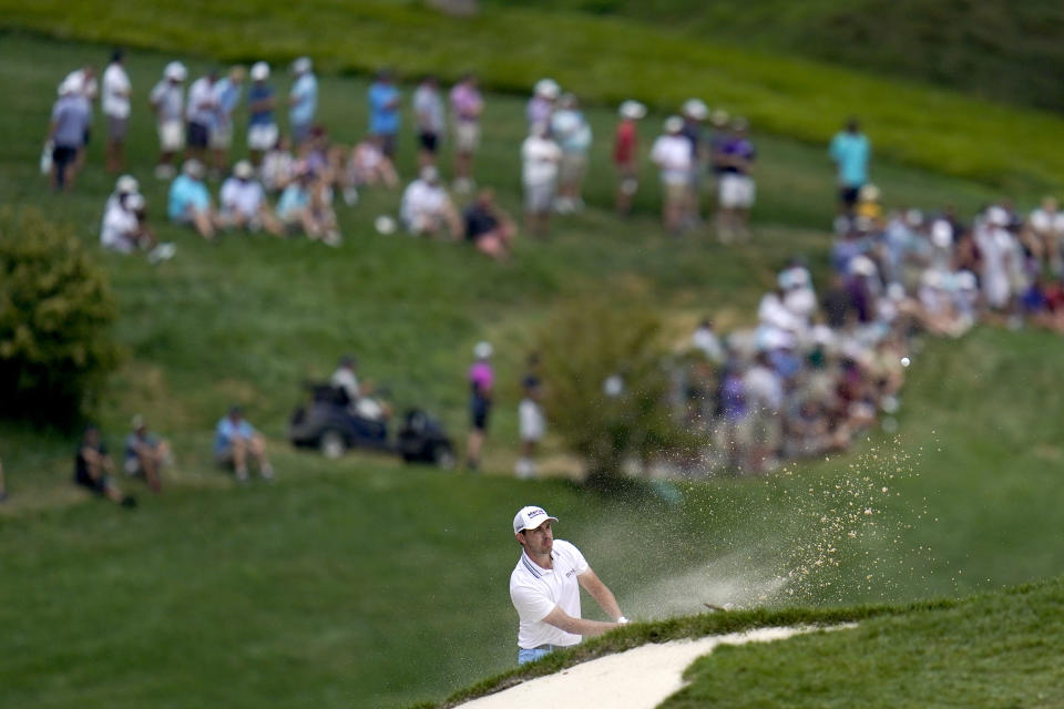 Patrick Cantlay hits out a sand trap on the fifth hole during the final round of the BMW Championship golf tournament, Sunday, Aug. 29, 2021, at Caves Valley Golf Club in Owings Mills, Md. (AP Photo/Julio Cortez)