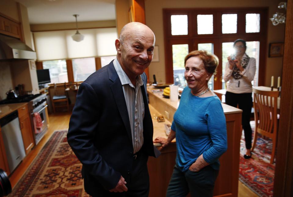 University of Chicago Professor Fama is pictured in his house with his wife after finding out he won the 2013 Nobel Prize in Economics in Chicago