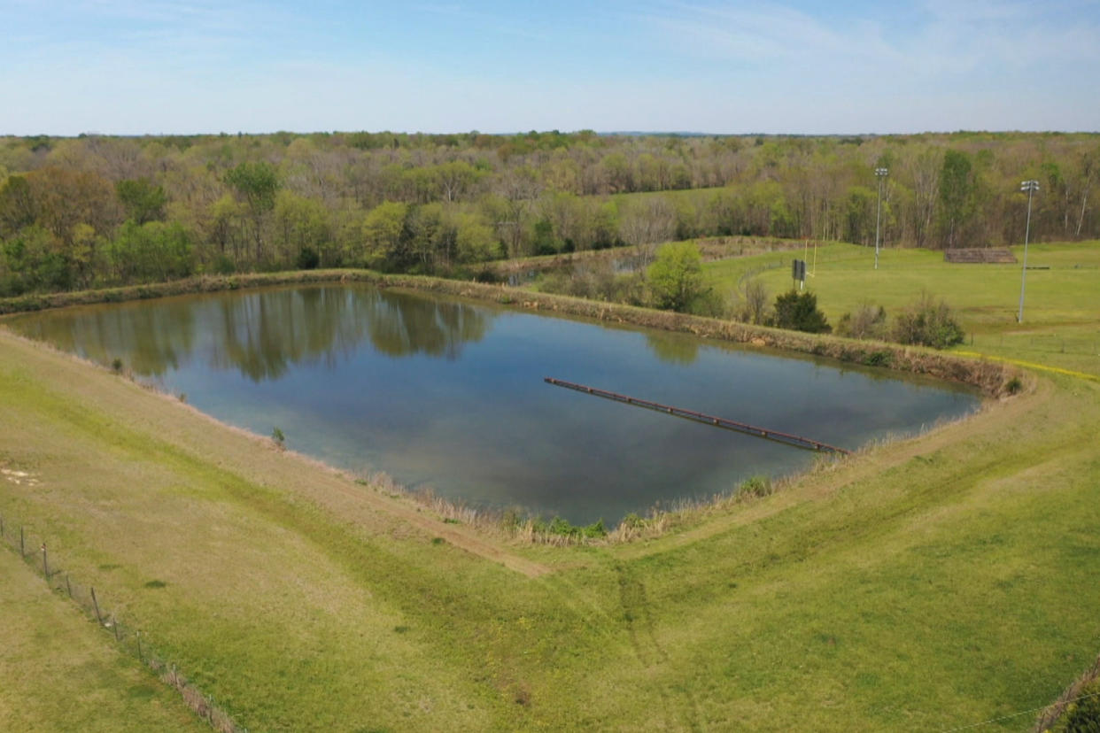 Dark green waters across from a home holds a foul smelling mix of human waste in Lowndes County, Alabama.  (NBC News)