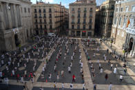 Medical residents take part on a protest against their working conditions during a strike in Barcelona, Spain, Tuesday, Oct. 20, 2020. Spain has become the first western Europe to accumulate more than 1 million confirmed infections as the country of 47 million inhabitants struggles to contain a resurgence of the coronavirus. (AP Photo/Emilio Morenatti)