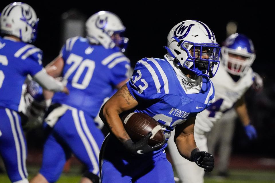 Wyoming running back C.J. Hester (33) runs the ball during the first half of an OHSAA Division IV high school football regional semifinal against Clinton-Massie at Lakota West High School, Saturday, Nov. 12.