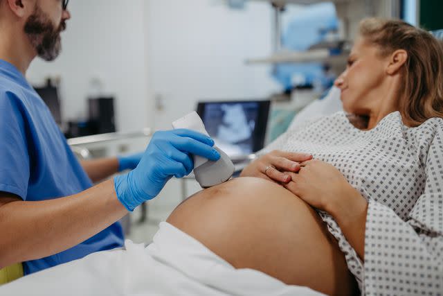 <p>Getty</p> Stock image of Ob/gyn doctor doing ultrasound of baby on pregnant woman