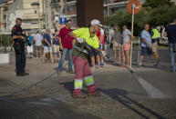 <p>A municipal worker washes the pavement on the spot where terrorist were shot by police in Cambrils, Spain, Friday, Aug. 18, 2017. (Photo: Emilio Morenatti/AP) </p>