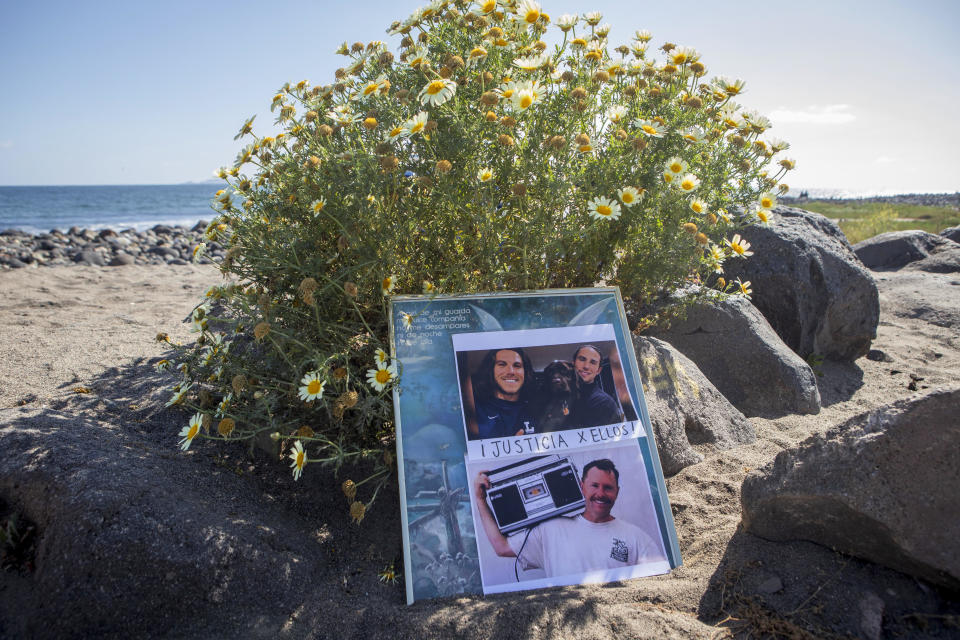 The photos of the foreign surfers who disappeared are placed on the beach in Ensenada, Mexico, Sunday, May 5, 2024. Their bodies were later found. / Credit: Karen Castaneda / AP