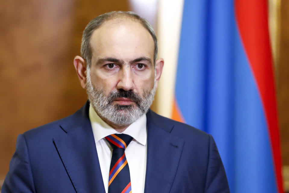 Armenian Prime Minister Nikol Pashinian pauses as he speaks at the Armenian parliament in Yerevan, Armenia, Sunday, Sept. 27, 2020. Pashinian on Sunday said the country could reexamine whether to recognize Nagorno-Karabakh as independent. Such a move would likely obstruct further negotiations. (Tigran Mehrabyan, Government Press Office, PAN Photo via AP)