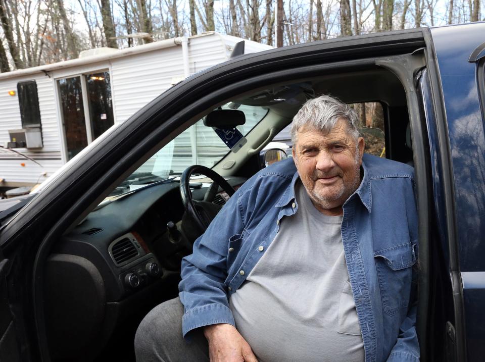 Tom Barr, 76, a Purple Heart Vietnam veteran and former Eliot, Maine police chief, sits in his truck in front of his "new temporary" home.