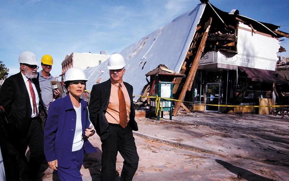 U.S. Senator Barbara Boxer toured the San Simeon Earthquake damage in Paso Robles on Jan. 9, 2004. Walking past the Acorn Building with Boxer is (left) Mayor of Atascadero George Luna and Mayor of Paso Robles Frank Mecham.