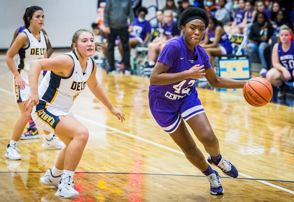 Central's Jasiah Scaife dribbles past Delta's defense during their game at Delta High School Thursday, Nov. 4, 2021. 