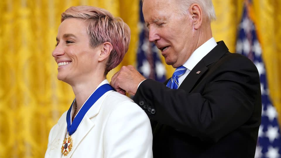 Joe Biden awards the Presidential Medal of Freedom to Rapinoe during a ceremony at the White House in 2022. - Kevin Lamarque/Reuters