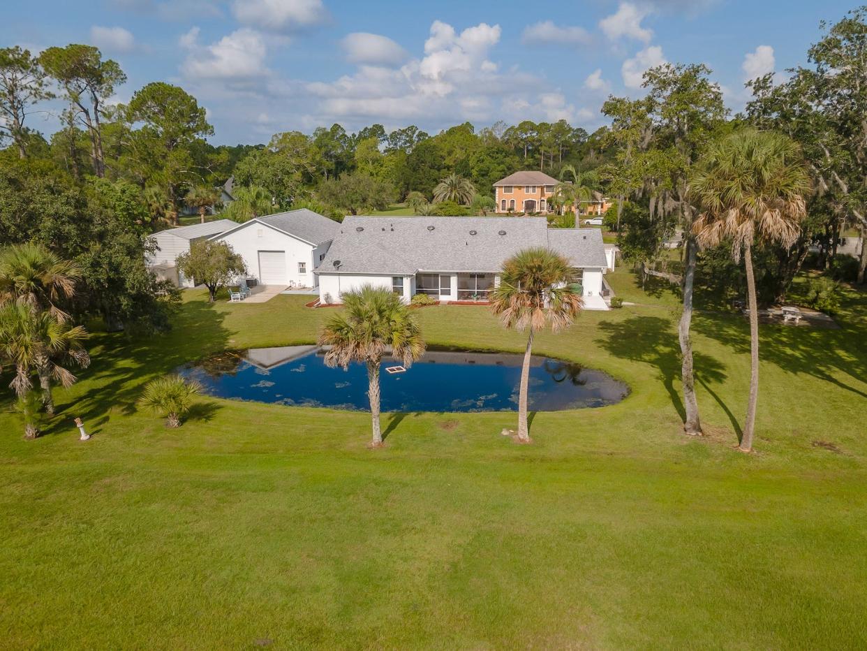 This classic ranch home, sitting quietly on a serene two and a half acres in a small private neighborhood in Port Orange.