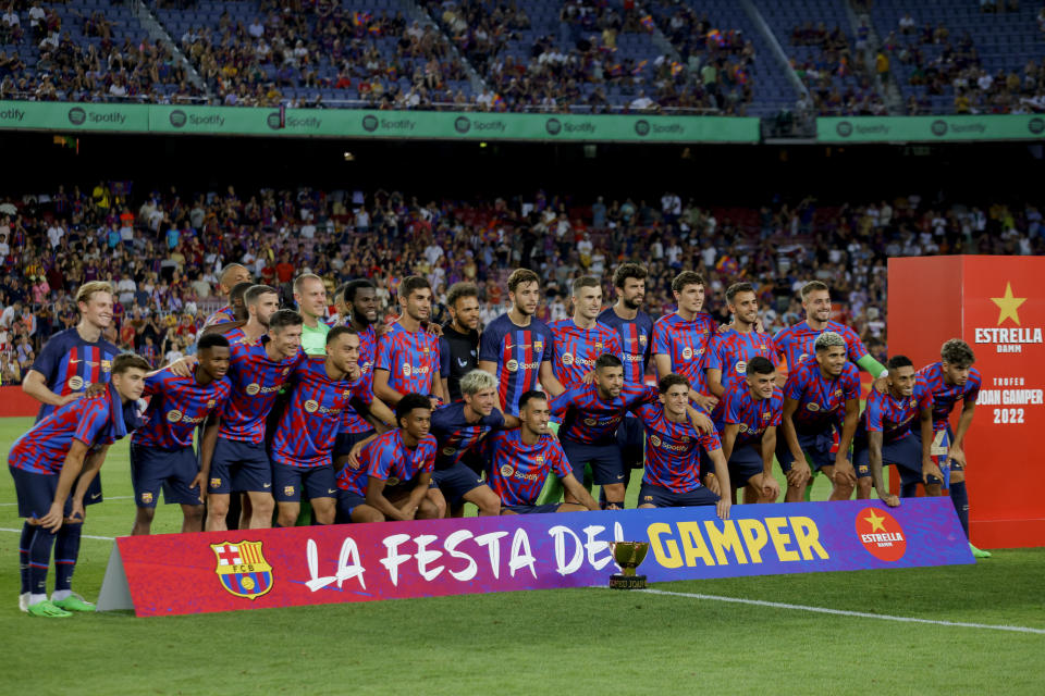 Barcelona team players celebrate after winning the Joan Gamper trophy match between FC Barcelona and Pumas Unam at the Camp Nou Stadium in Barcelona, Spain, Sunday, Aug. 7, 2022. (AP Photo/Joan Monfort)