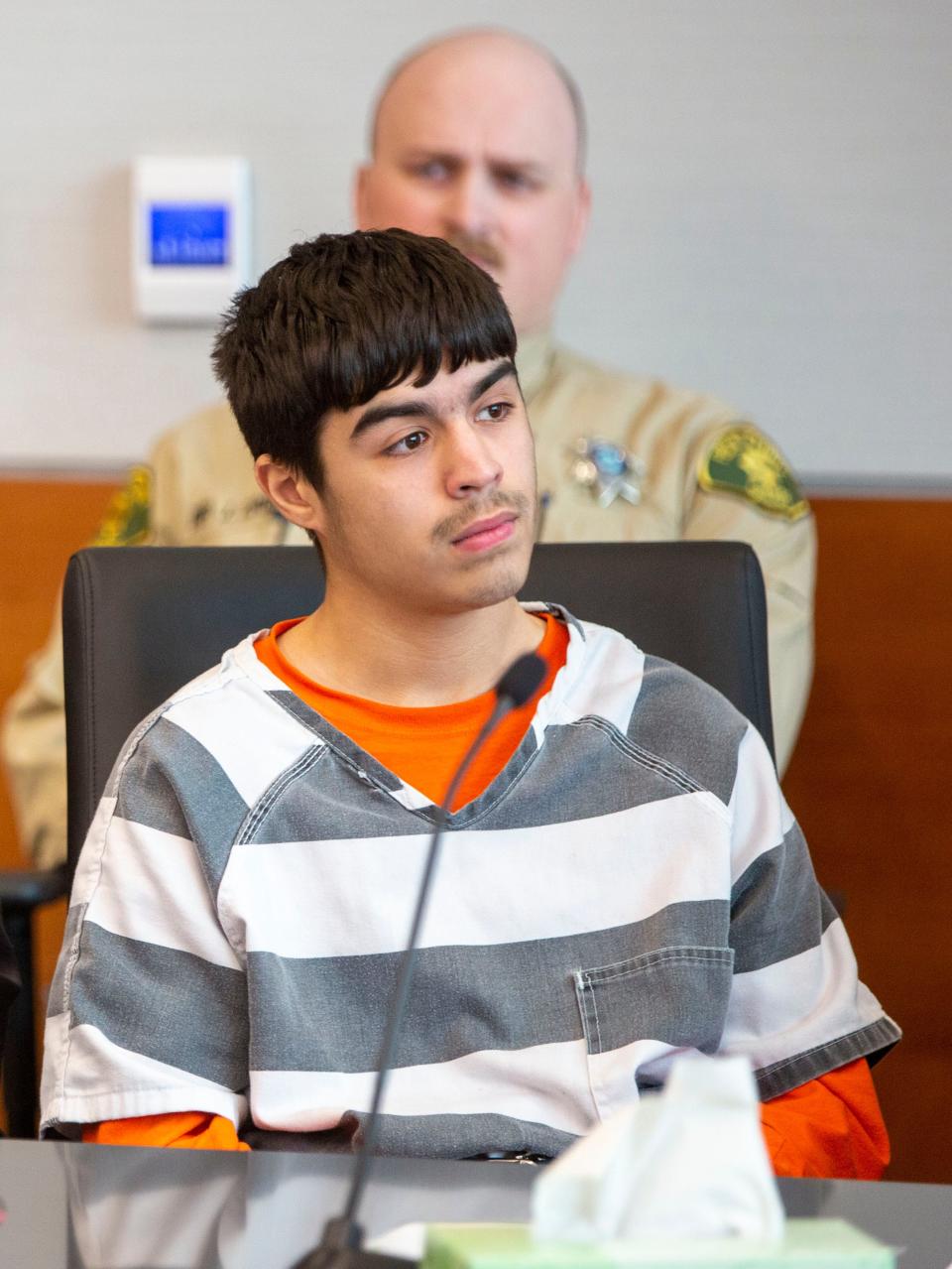 Romeo Perdomo, 17, one of the 10 youths charged in the March 7 fatal shooting outside East High, appears at a hearing Monday requesting the transfer of his case to juvenile court.