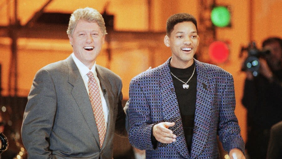 Bill Clinton and Will Smith pose for a photo.