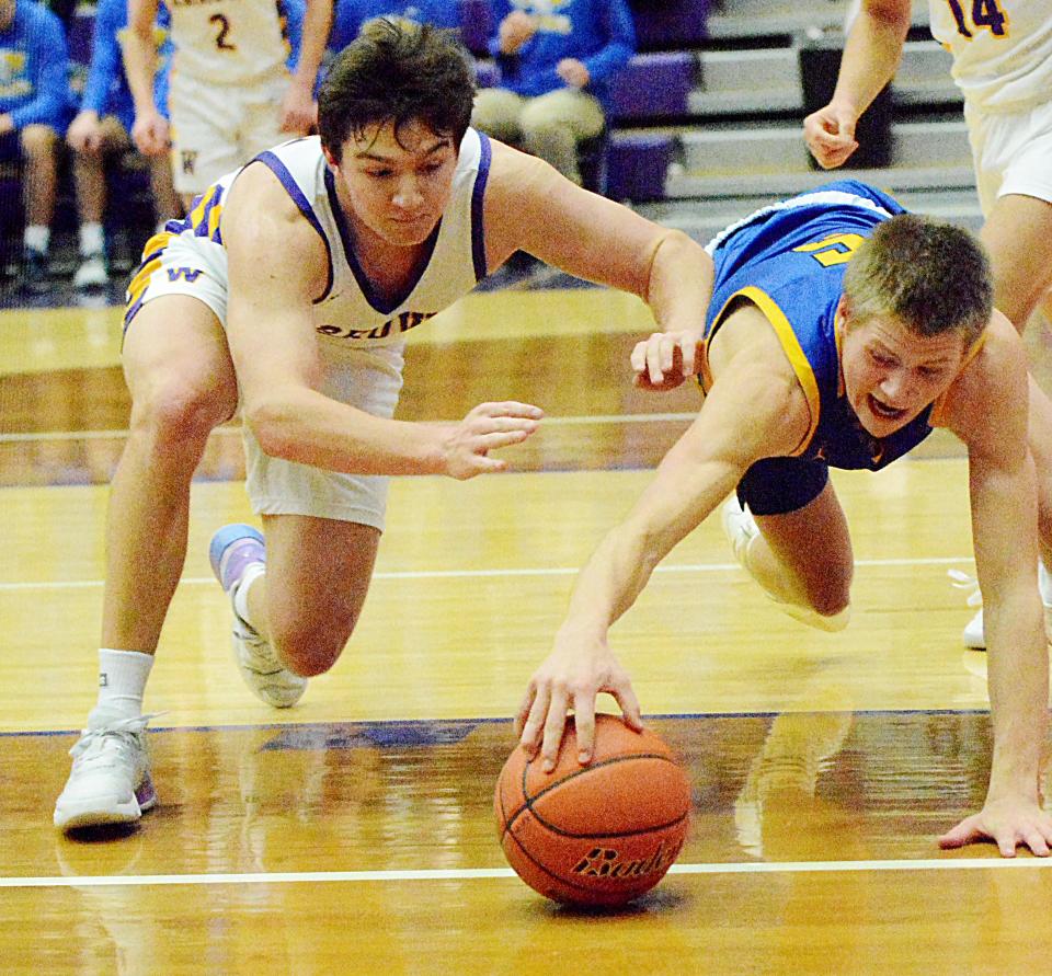 Aberdeen Central's Jett Carlson (right) and Watertown's Jake Olson dive for a loose ball during their high school boys basketball game on Tuesday, Jan. 10, 2023 in the Watertown Civic Arena. Watertown won 48-30.