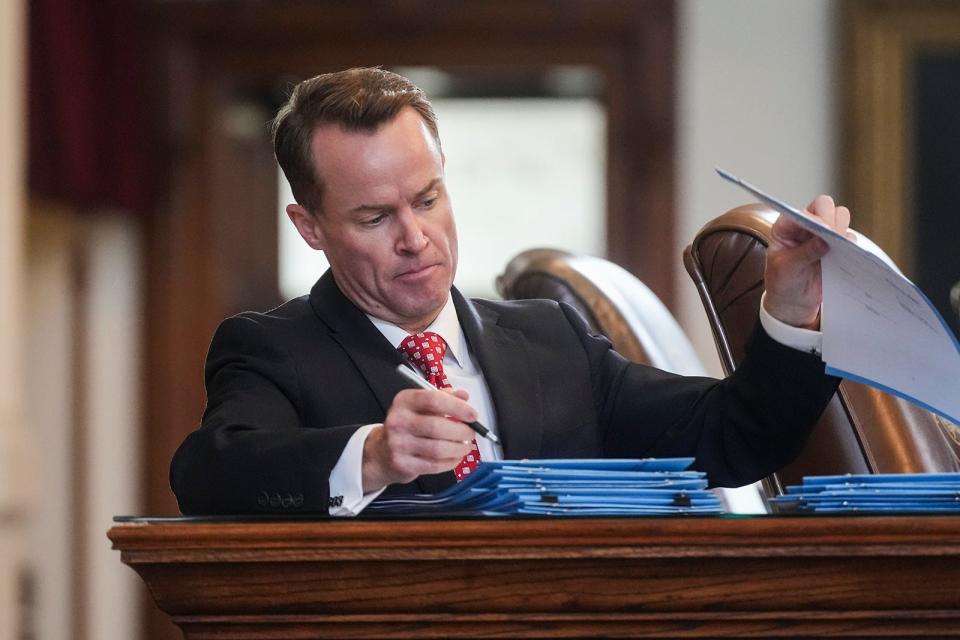 Rep. Dade Phelan, R-Beaumont, signs bills during Sine Die in the House of Representatives at the Texas Capitol on Monday, May 29, 2023. 