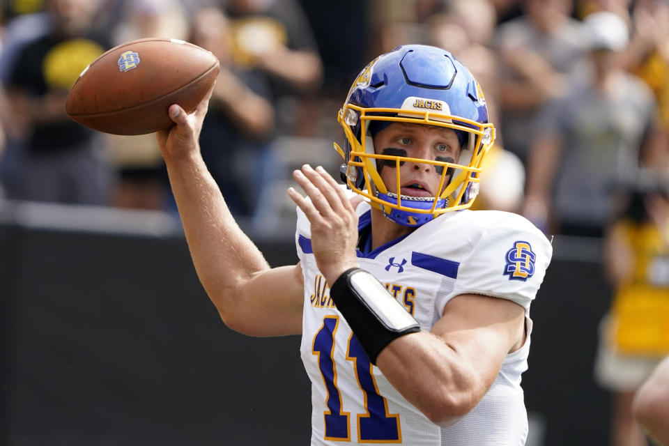 South Dakota State quarterback Mark Gronowski (11) looks to pass during the first half of an NCAA college football game against Iowa, Saturday, Sept. 3, 2022, in Iowa City, Iowa. Nearly 20 months after tearing the ACL in his left knee on a 3-yard run, and then missing the rest of that game and all of the normal 2021 fall season that quickly followed, Gronowski gets another title shot Sunday when the Jackrabbits play Missouri Valley Football Conference rival and perennial FCS champion North Dakota State. (AP Photo/Charlie Neibergall, File)