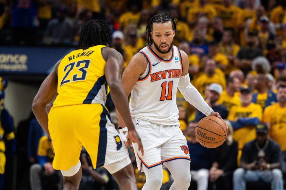 May 10, 2024; Indianapolis, Indiana, USA; New York Knicks guard Jalen Brunson (11) dribbles the ball while Indiana Pacers forward Aaron Nesmith (23) defends during game three of the second round for the 2024 NBA playoffs at Gainbridge Fieldhouse. Mandatory Credit: Trevor Ruszkowski-USA TODAY Sports