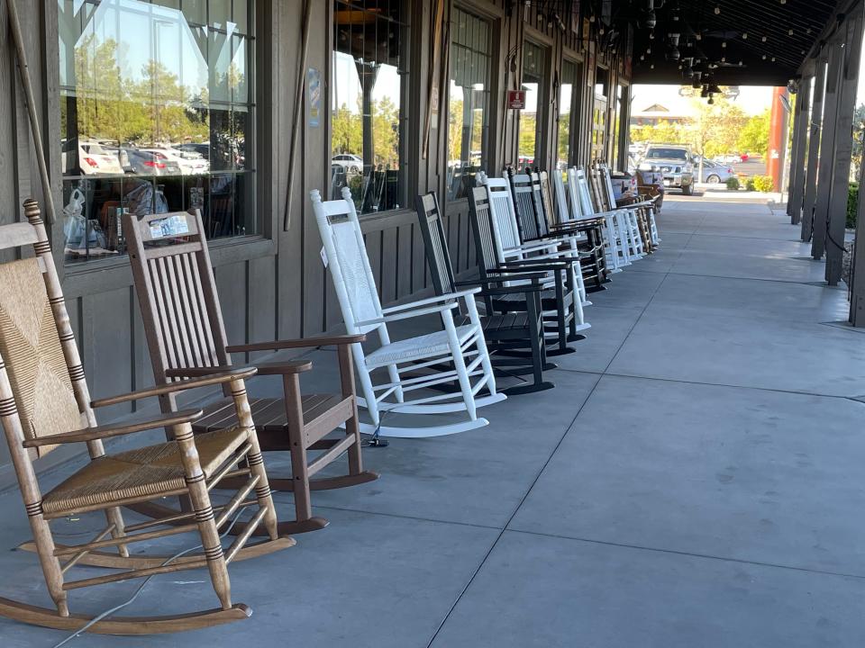 Rocking chairs line the entry way of Cracker Barrel
