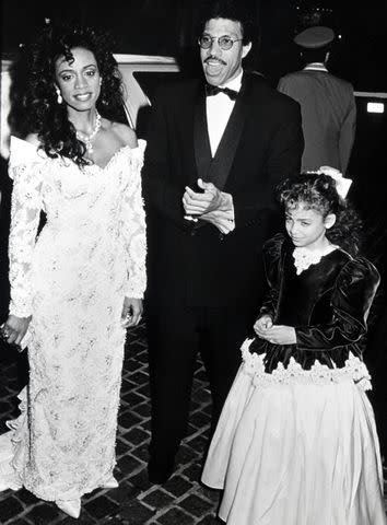 <p>Ron Galella/Ron Galella Collection via Getty</p> Nicole Richie with dad Lionel Richie and mom Brenda Harvey Richie