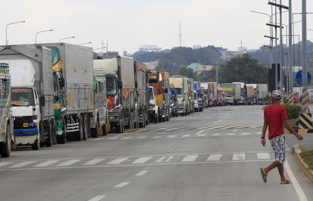 A long queue of stranded vehicles wait outside a port in Batangas city, south of Manila December 14, 2015, after all ferry boats were cancelled due to typhoon Melor. REUTERS/Romeo Ranoco