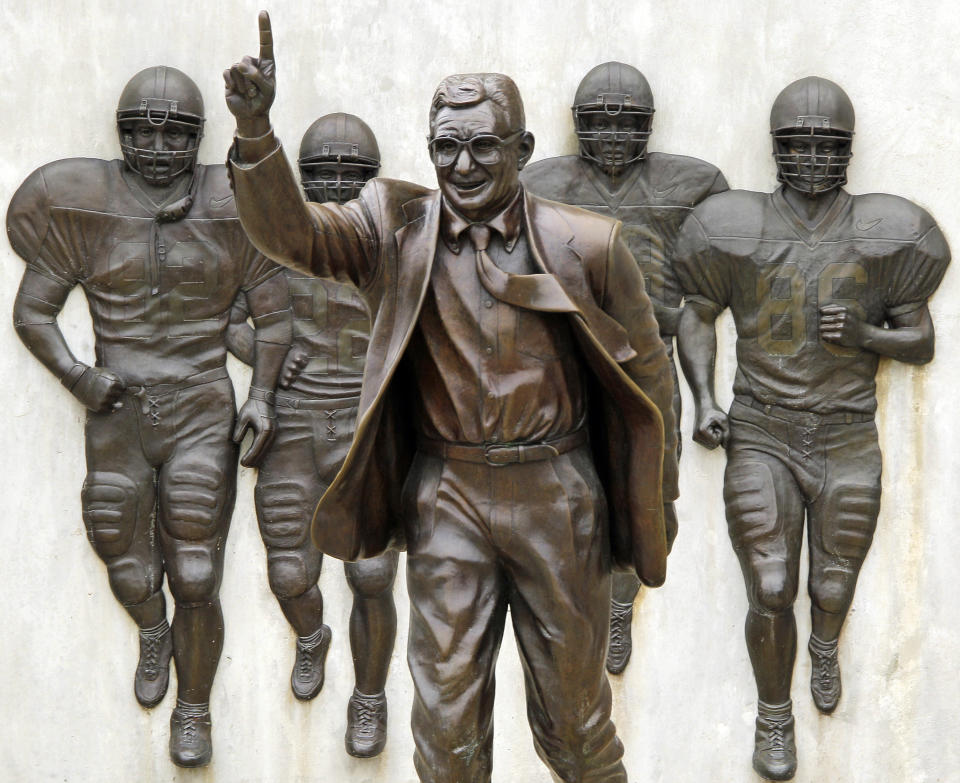 File-This July 13, 2020, shows the statue of former Penn State University head football coach Joe Paterno outside Beaver Stadium. Though the statue has been taken down, Penn State and the family of Paterno announced Friday, Feb. 21, 2020, they had resolved “the outstanding issues” that divided them, eight years after he was fired after Jerry Sandusky's child molestation arrest. The university and Paterno's widow, Sue Paterno, both issued statements that Penn State had agreed to pay “certain of the Paterno family's expenses” and wished to move forward. The amount was not disclosed. (AP Photo/Gene J. Puskar, File)